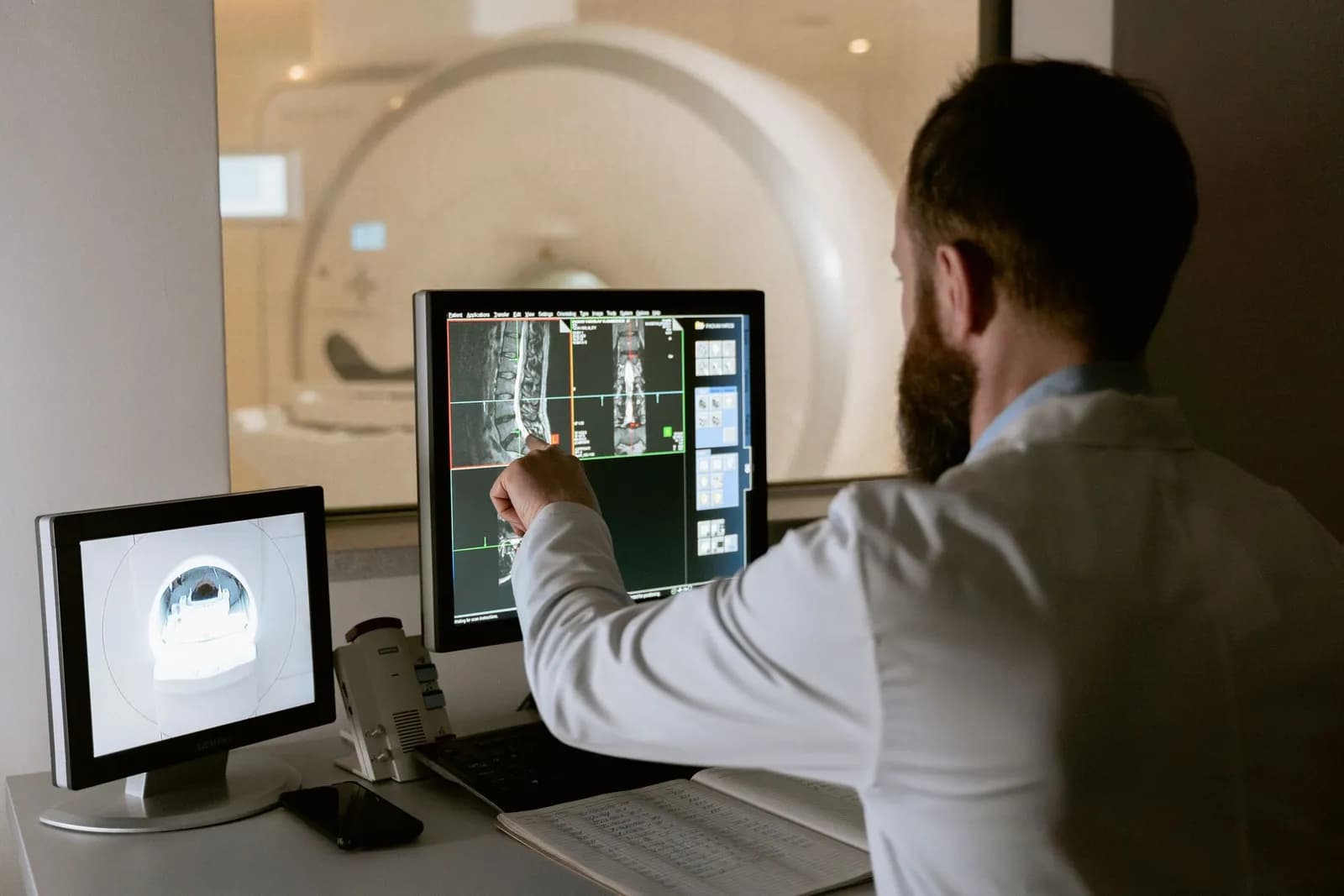 A clinician reviewing diagnostic imaging results on a clinical workstation.